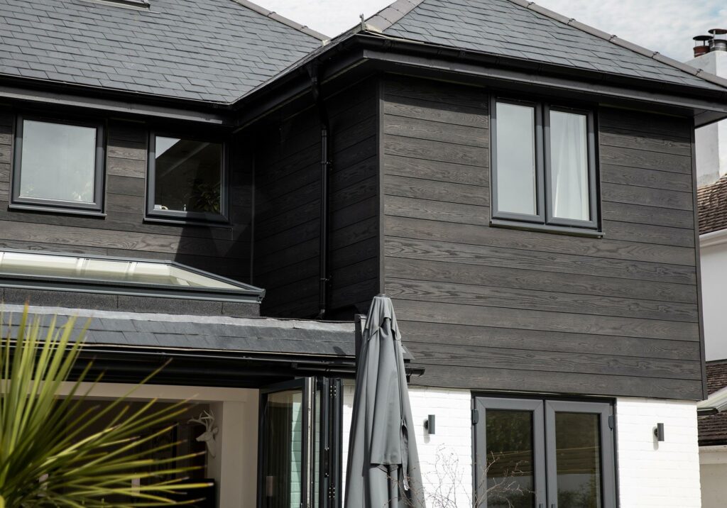 A Classic Black Home with Composite Siding